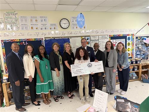 Annabel Richter, columbia elementary, holding check